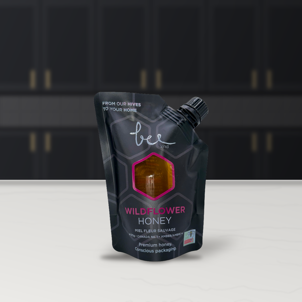 Bee Kind Okanagan Pure Wildflower Honey pouch in a kitchen